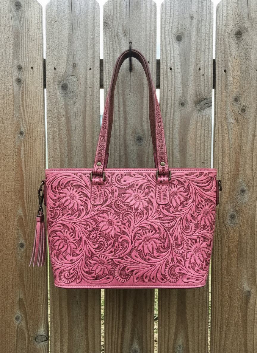 Pink tooled leather cowhide tote with quilted back, double straps, and detachable crossbody strap