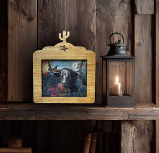 Texas-inspired longhorn canvas art with floral and cactus elements