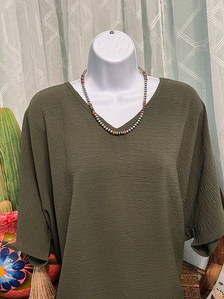 Women's relaxed fit v-neck top in a wrinkle-friendly textured material