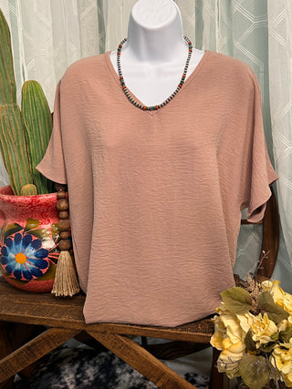 Andi Top featuring a flattering v-neckline and lightweight textured fabric