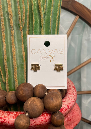 A and M gold plated stud earrings close up game day jewelry