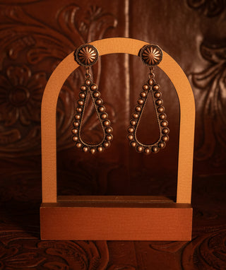 Copper open teardrop statement earrings with concho-inspired post backs