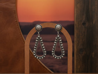 Silver Western teardrop earrings with engraved concho studs and beaded detailing