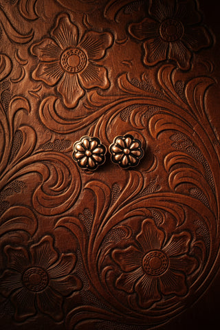 Copper tone fashion stud earrings featuring a floral western design.