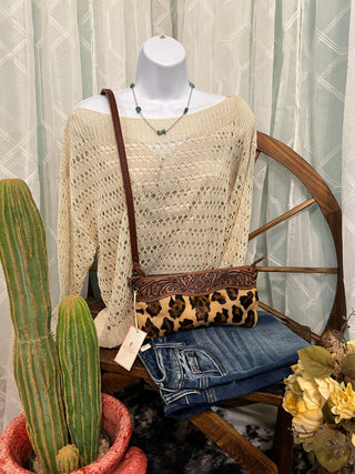 Emma Crochet Top in cream featuring an open knit design and boat neckline