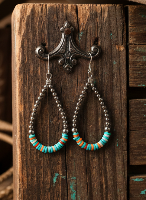Sterling silver teardrop earrings with turquoise and orange spiny oyster heishi bead center, accented with silver pearls and french hook closure, showing natural color variation.