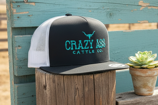 black and white trucker hat with turquoise lettering breathable mesh back western cap