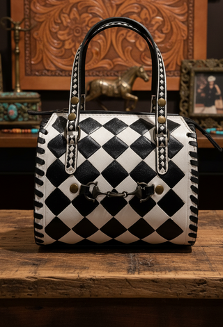Black and white mini speedy bag with snaffle bit hardware and whipstitch detailing