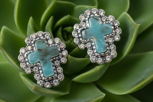 Silver-tone stud earrings with turquoise-style cross centers and rhinestone edging, approximately 0.75 inches in size.