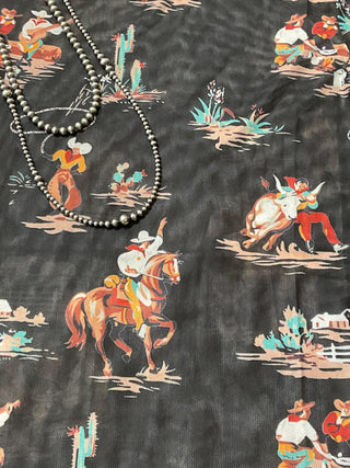 Women's black western mesh top featuring cowboys, horses, cacti, and ranch-inspired artwork.
