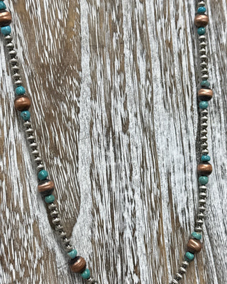     Sterling silver and copper bead necklace with turquoise stones in a bold strand design