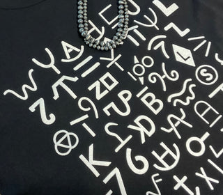 Ranch Brand graphic tee featuring classic western brand symbols on black Bella Canvas shirt