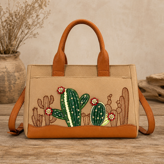 Faux leather satchel handbag with desert cactus artwork and organized interior