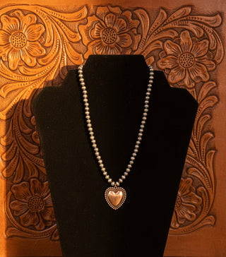 Heart pendant necklace with copper toned pearls