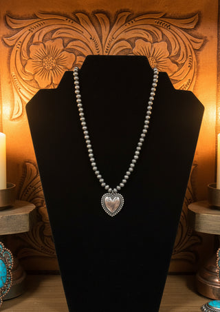 Heart pendant necklace with silver toned pearls