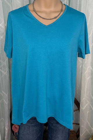 Women's turquoise boutique top styled with denim for everyday wear