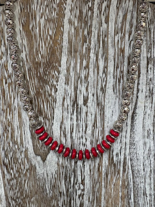 Red beaded western necklace with ornate silver beads and adjustable extender chain