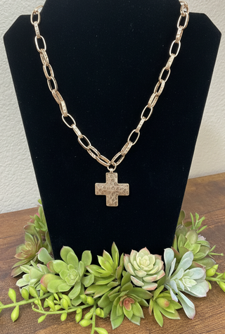 Water-resistant hammered cross necklace available in silver and gold tone