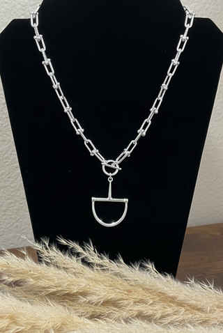 Water-resistant silver equestrian necklace featuring a half snaffle bit pendant