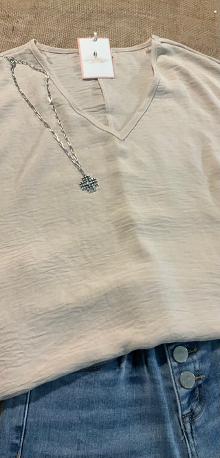 Women's relaxed fit v-neck top in a wrinkle-friendly textured material