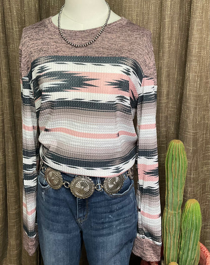 Natalie Aztec Pullover, a super soft long-sleeve top with an Aztec color block design featuring shades of grey and pink.