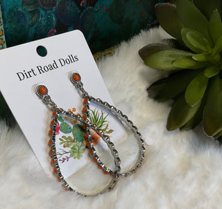 Silver-tone teardrop earrings with ornate detailing and orange colored center stones; approx. 2.75" long