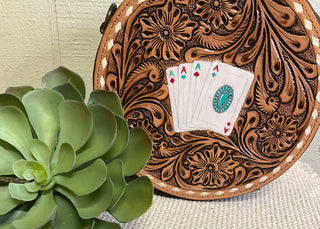 Genuine leather tooled canteen bag with hand-painted Aces, turquoise concho, rawhide stitching, and adjustable tooled strap