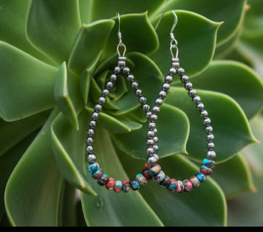 Sterling silver beaded teardrop earrings with sea sediment rondelle beads and French hook backs.