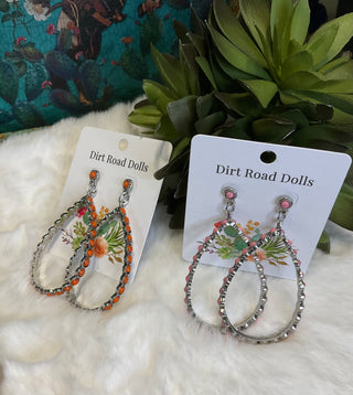 Silver-tone teardrop earrings with ornate detailing and colored center stones, available in pink and orange; approx. 2.75" long