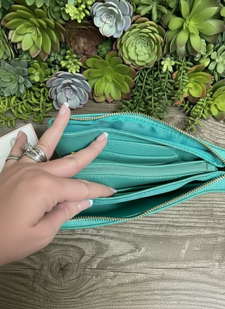 Selma Convertible Bag in textured faux leather with gold-tone fixtures – versatile clutch, wristlet, or crossbody with three zippered compartments and two card slots for organized day-to-night style.