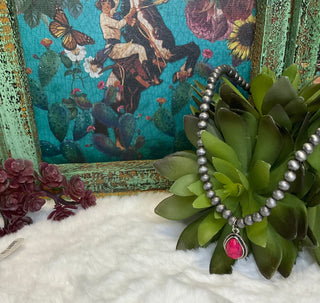 Statement necklace with silver pearl strand and bold teardrop stone pendant