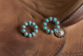 Small silver-tone stud earrings with a circular halo of faux turquoise stones.