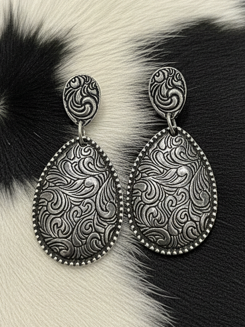 Tooled Ridge Drops in silver-tone metal featuring tooled stud tops and matching tooled teardrop dangles with dot-edged trim; approx. 2-inch lightweight high-shine earrings