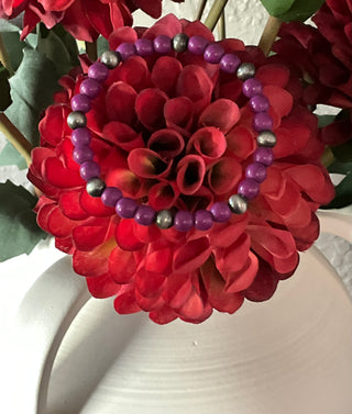 Bold purple beaded stretch bracelet with faux silver pearl accents