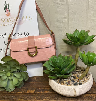 Two tone faux leather handbag featuring crocodile texture and metal ring flap closure