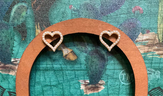 Gold-toned open heart stud earrings outlined with tiny pearlized beads, approx. 1/2 inch