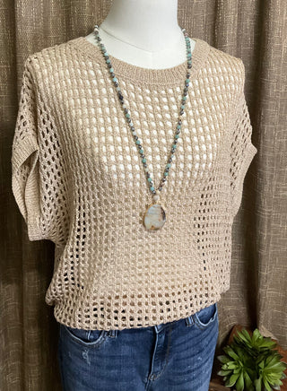 Relaxed fit crocheted knit top in khaki with open weave texture and short sleeve casual styling