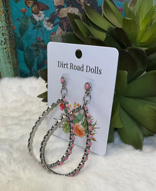 Silver-tone teardrop earrings with ornate detailing and colored center stones, available in pink; approx. 2.75" long
