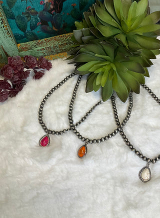 Last Teardrop necklace with rustic silver beads and colorful stone pendant close up