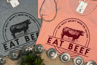Women's western graphic shirt available in coral and gray color options