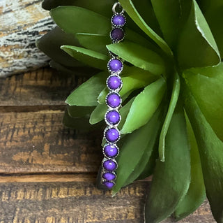 Silver-tone teardrop earrings with ornate detailing and purple colored center stones; approx. 2.75" long