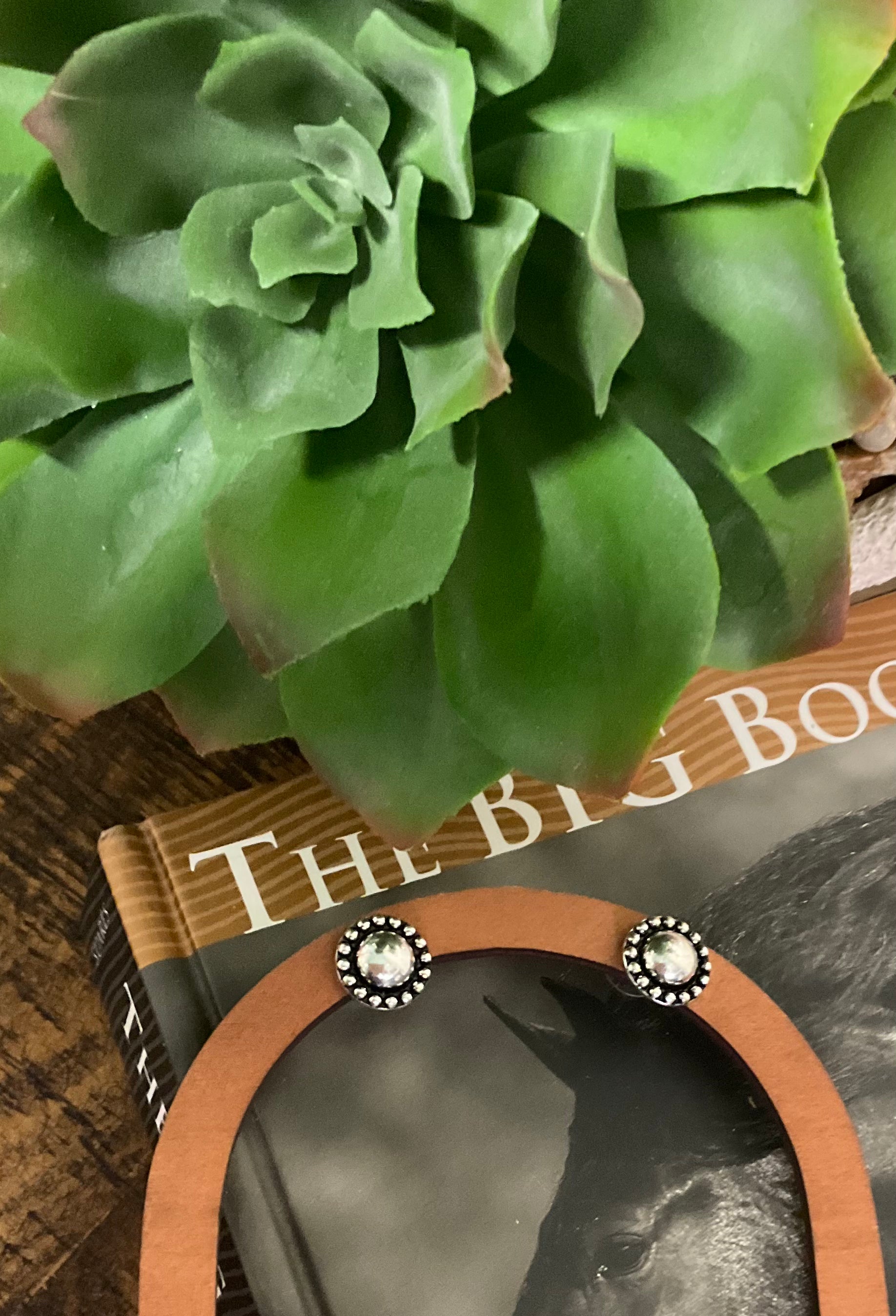 1/2" round silver-tone stud earrings with bubble-dot edging, western-inspired design