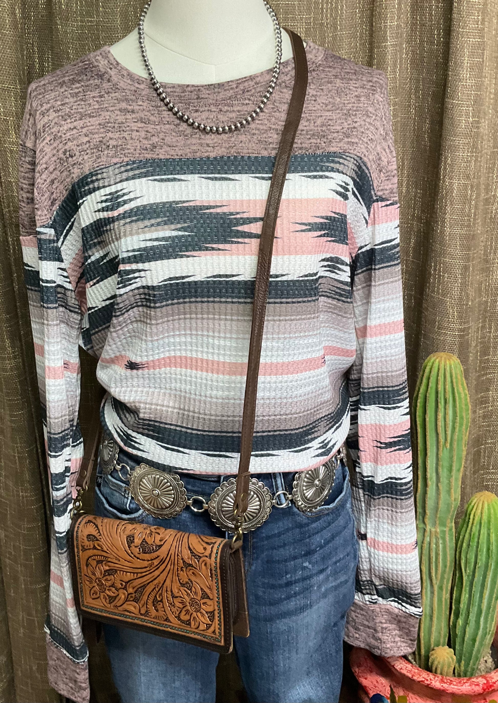 Natalie Aztec Pullover, a super soft long-sleeve top with an Aztec color block design featuring shades of grey and pink.