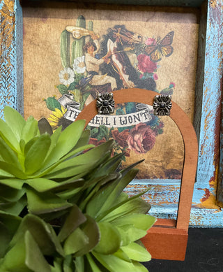 Silver-tone ornate post earrings with black center stone and western boutique style