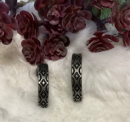 Southwest-inspired Red River Hoop Earrings in faux silver or copper with intricate design, 1.25-inch diameter.