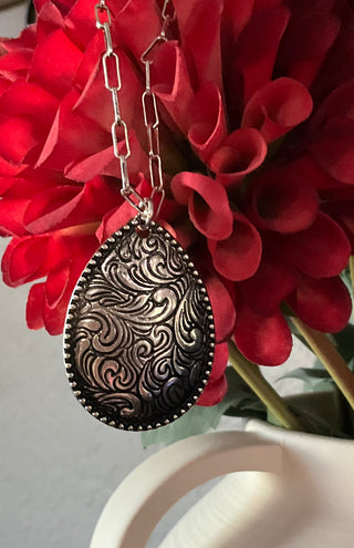 western style necklace with engraved teardrop pendant silver tone