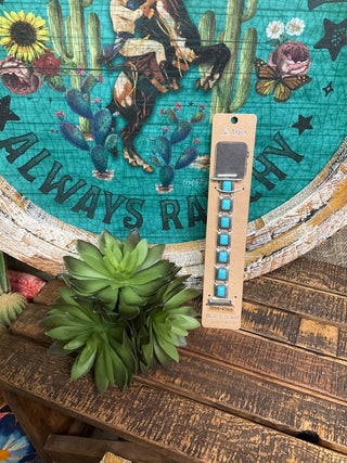 Houston stretch Apple Watch band with silver toned links and faux turquoise stones for 38mm, 40mm, and 41mm Apple Watches.
