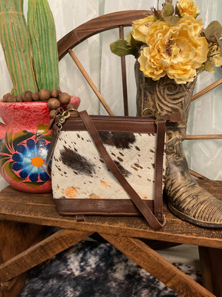 American Darling genuine hair-on cowhide bag with rose gold splatter finish and adjustable crossbody strap