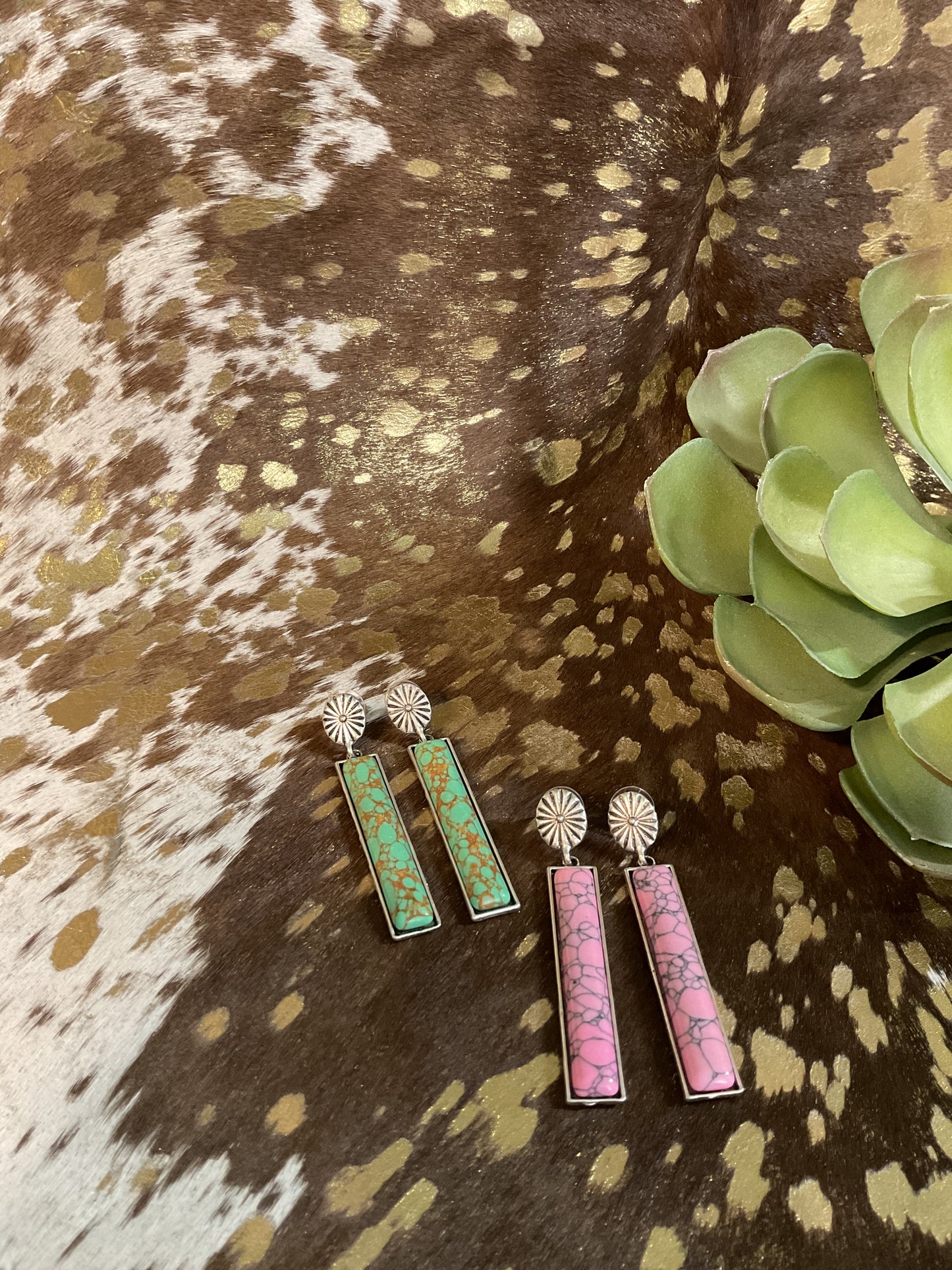 Silver-tone concho stud earrings with 2.75" dangling pink stone bar, western-inspired design