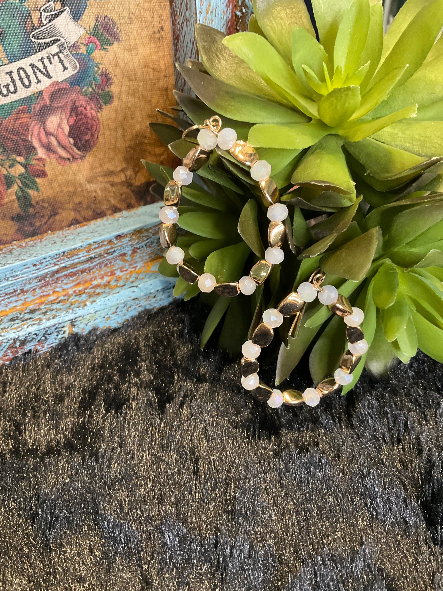 Approx 2" beaded teardrop earrings in white and faux gold with french hook